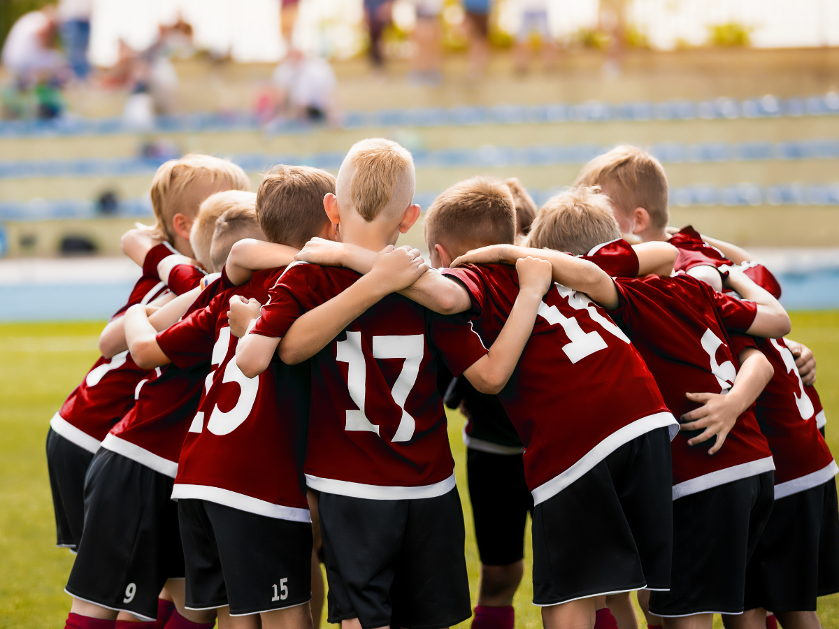 Youth sports team gathered together after a game