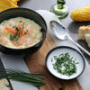 Sweetcorn & Prawn Chowder served with crusty bread, fresh corn and chives