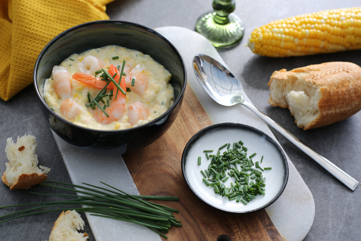 Sweetcorn & Prawn Chowder served with crusty bread, fresh corn and chives