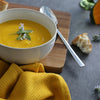 Butternut, Sage & Ginger Soup in a bowl with sage garnish