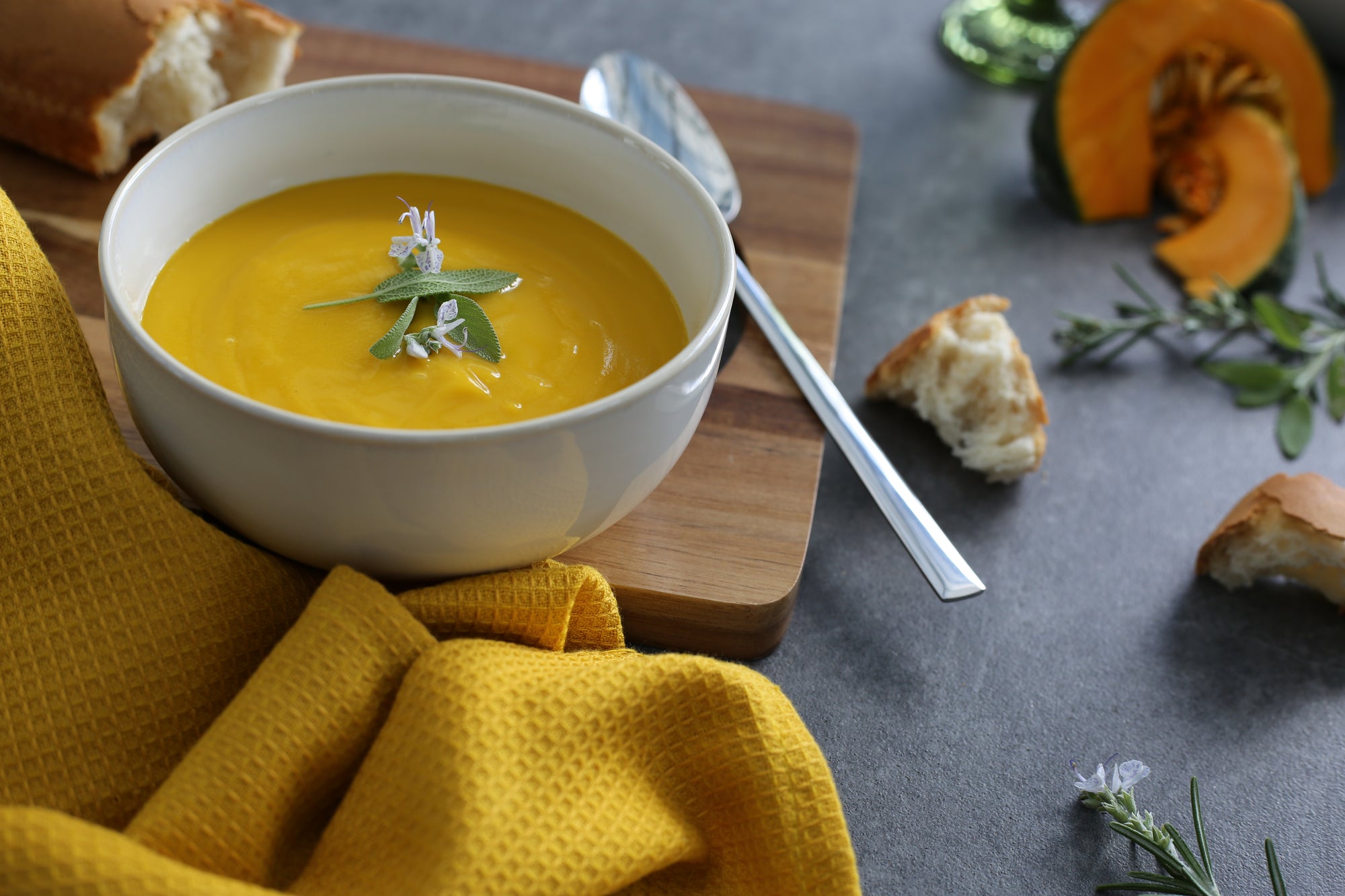 Butternut, Sage & Ginger Soup in a bowl with sage garnish