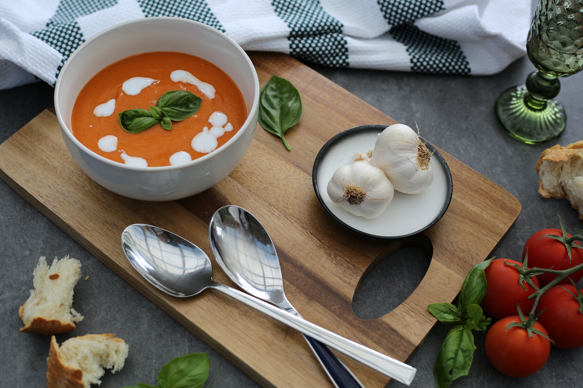 Tomato & Basil Soup with a drizzle of cream and fresh basil